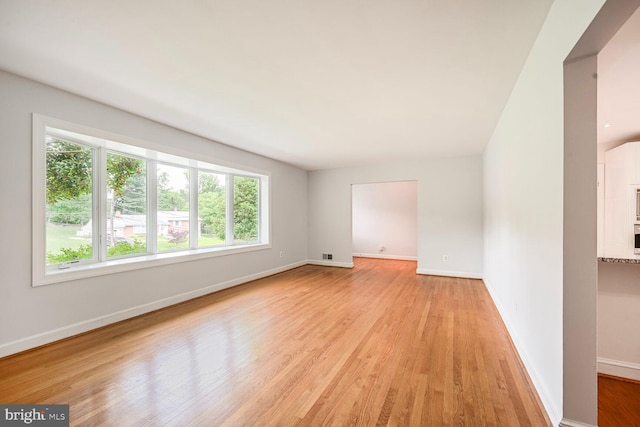 12405 Ellen Ct, Silver Spring, MD 20904 - empty room with light wood-style floors and baseboards