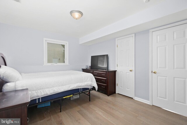 bedroom featuring wood finished floors