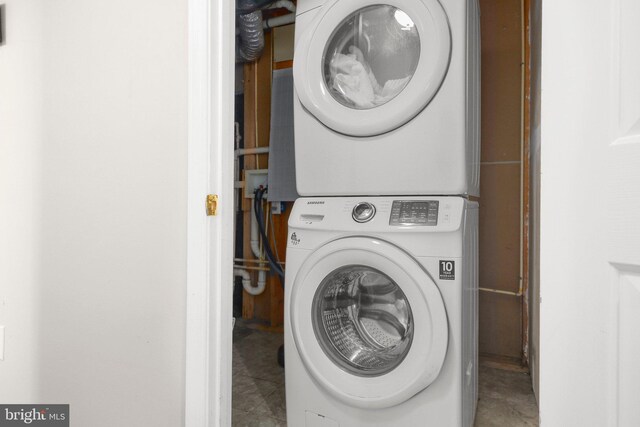 laundry area featuring laundry area and stacked washer / dryer