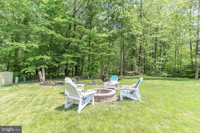 view of yard with an outdoor fire pit