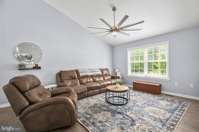 living area featuring visible vents, a ceiling fan, baseboards, and lofted ceiling