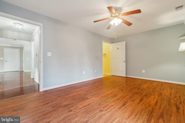 2013 Rudy Serra Dr Unit 2D, Eldersburg, MD 21784 - spare room featuring wood finished floors, baseboards, and ceiling fan