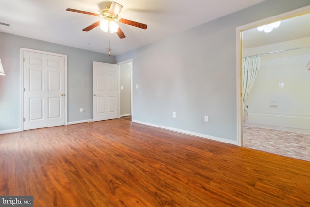 2013 Rudy Serra Dr Unit 2D, Eldersburg, MD 21784 - unfurnished bedroom with wood finished floors, baseboards, and a ceiling fan