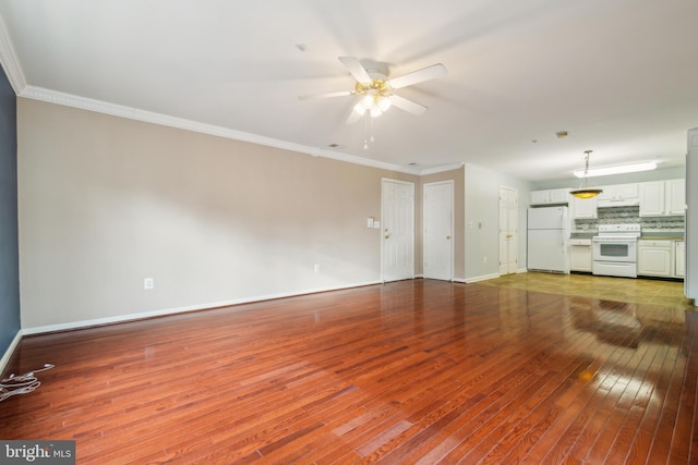 2013 Rudy Serra Dr Unit 2D, Eldersburg, MD 21784 - unfurnished living room with a ceiling fan, hardwood / wood-style floors, baseboards, and crown molding