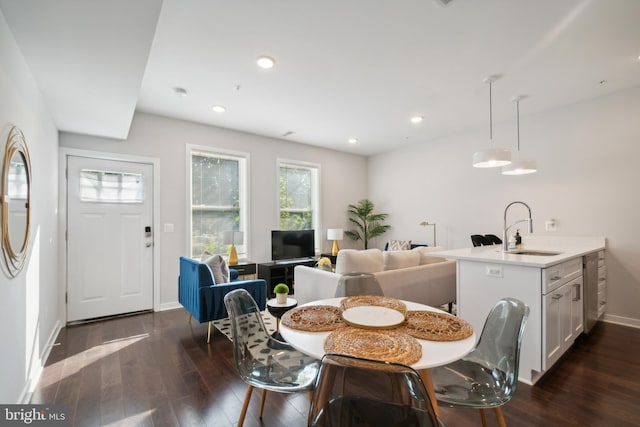 dining room featuring dark wood-style flooring, baseboards, and recessed lighting