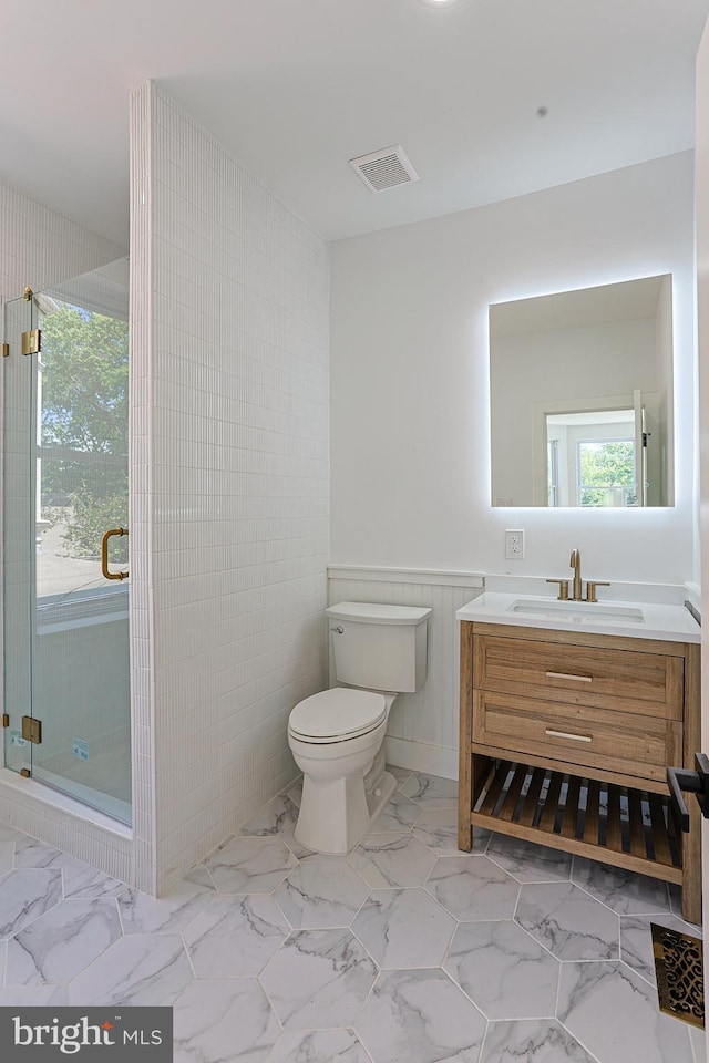 full bath with visible vents, a stall shower, vanity, toilet, and marble finish floor