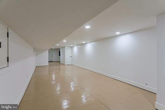 interior space featuring recessed lighting and baseboards