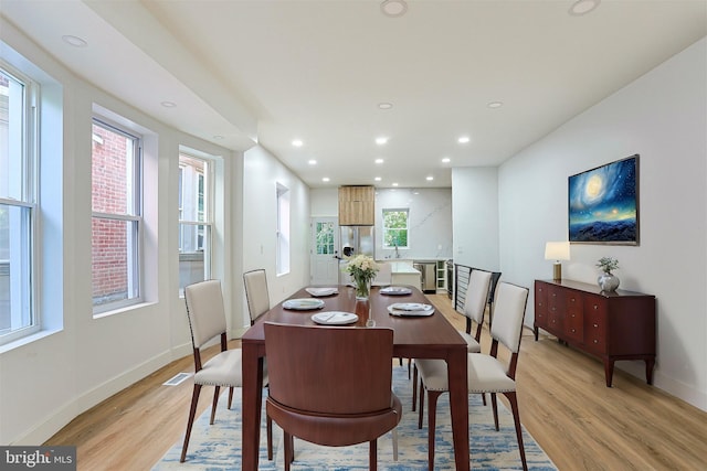 dining area featuring recessed lighting, light wood finished floors, baseboards, and visible vents