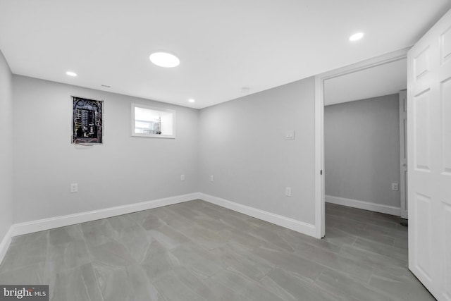 below grade area featuring baseboards and recessed lighting