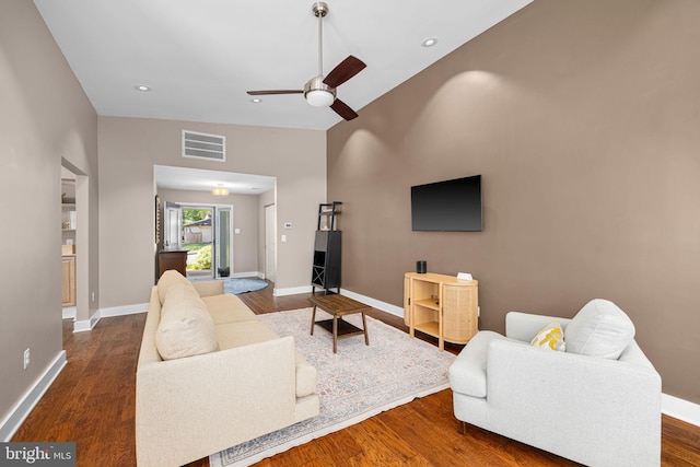 living room with baseboards, ceiling fan, wood finished floors, and visible vents