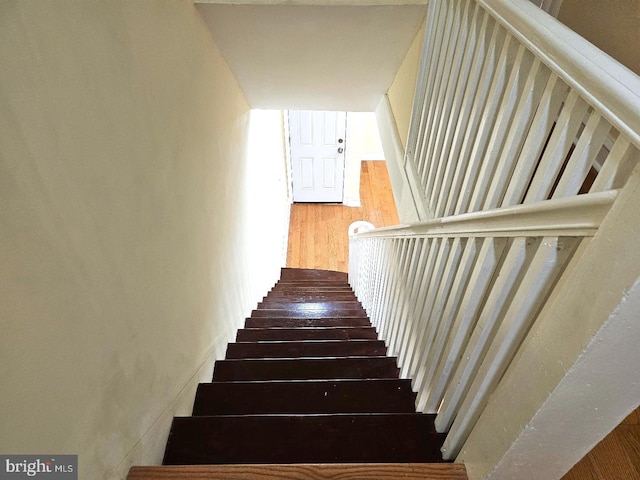 stairs with wood finished floors