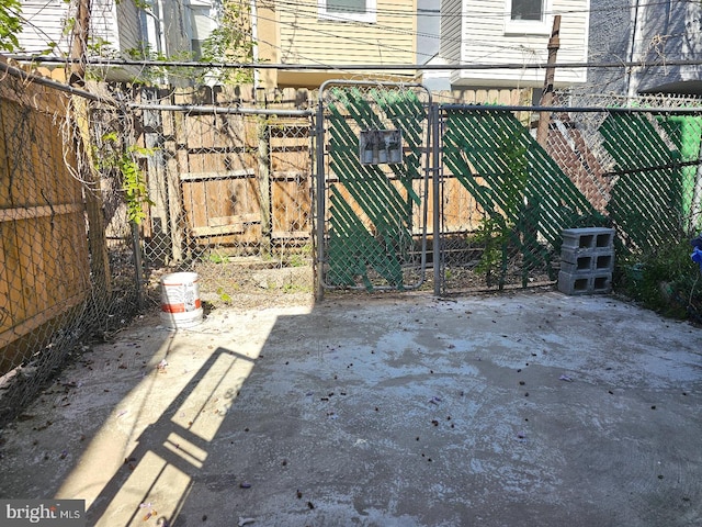 view of patio / terrace featuring fence and a gate