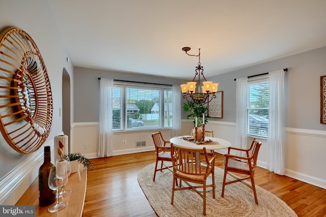 4255 Darleigh Rd, Baltimore, MD 21236 - dining area with plenty of natural light, light wood-style floors, a chandelier, and arched walkways