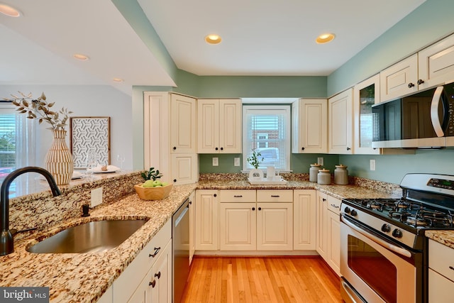 4255 Darleigh Rd, Baltimore, MD 21236 - kitchen featuring appliances with stainless steel finishes, a sink, light wood-style flooring, light stone countertops, and recessed lighting