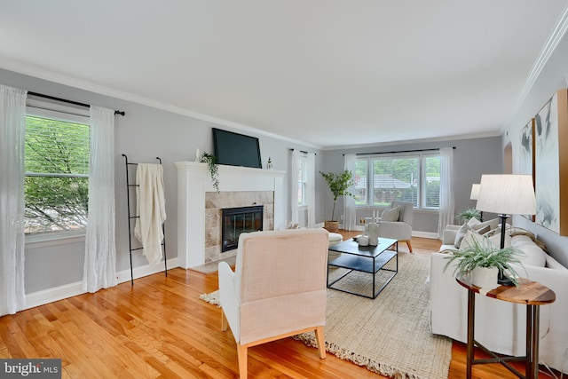4255 Darleigh Rd, Baltimore, MD 21236 - living room with crown molding, light wood-type flooring, baseboards, and a tile fireplace