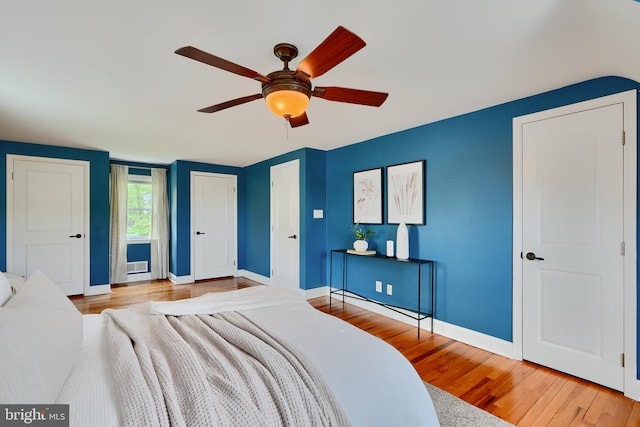4255 Darleigh Rd, Baltimore, MD 21236 - bedroom featuring wood finished floors, baseboards, a ceiling fan, and multiple closets