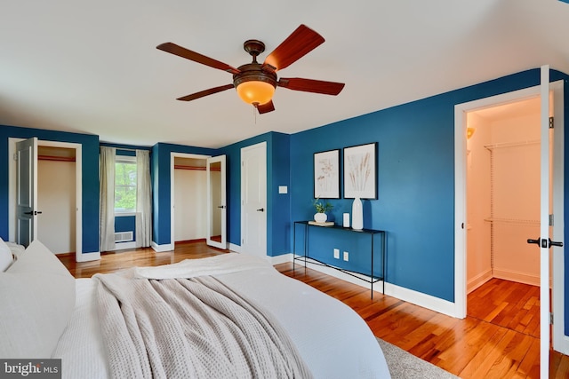 4255 Darleigh Rd, Baltimore, MD 21236 - bedroom with wood finished floors, baseboards, two closets, and a ceiling fan