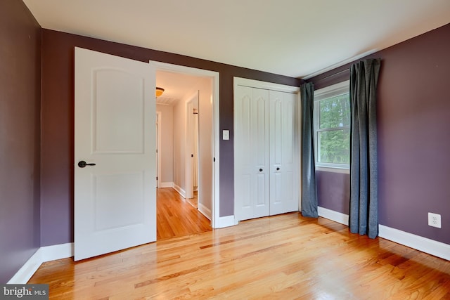 4255 Darleigh Rd, Baltimore, MD 21236 - unfurnished bedroom with light wood finished floors, a closet, and baseboards