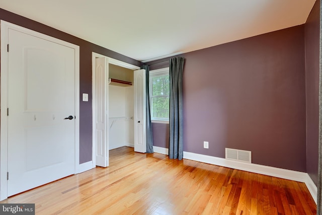 4255 Darleigh Rd, Baltimore, MD 21236 - unfurnished bedroom featuring baseboards, light wood-type flooring, and a closet