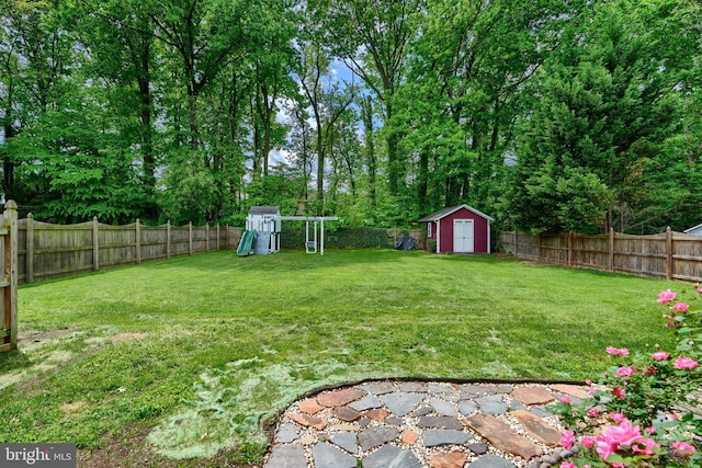 4255 Darleigh Rd, Baltimore, MD 21236 - view of yard featuring a playground, a storage unit, and an outbuilding