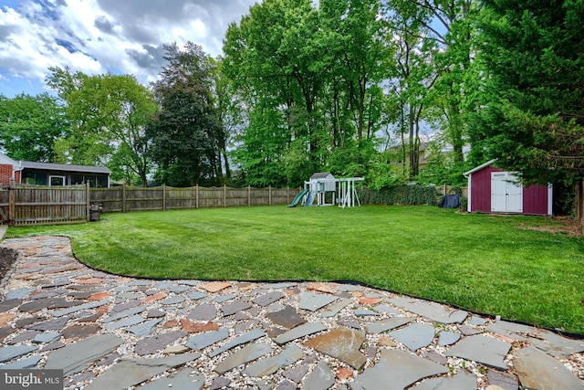 4255 Darleigh Rd, Baltimore, MD 21236 - view of yard featuring a patio, a playground, a storage shed, and an outdoor structure