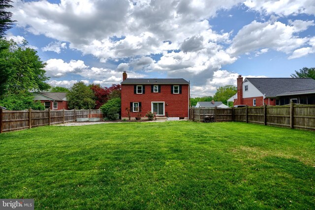 4255 Darleigh Rd, Baltimore, MD 21236 - back of house with entry steps, brick siding, and a chimney