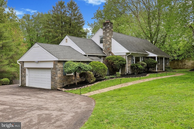 view of front of house featuring asphalt driveway, a garage, stone siding, and roof with shingles