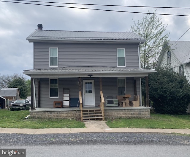 145 Grove St, Howard, PA 16841 - view of front of house featuring covered porch, a chimney, and metal roof