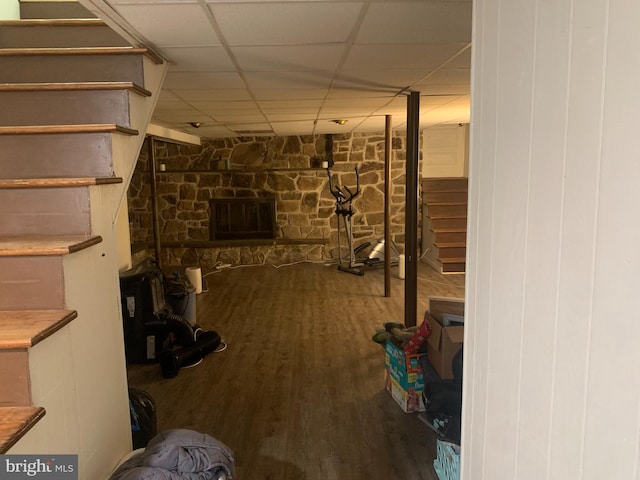 145 Grove St, Howard, PA 16841 - finished basement with a paneled ceiling, stairs, a stone fireplace, and wood finished floors