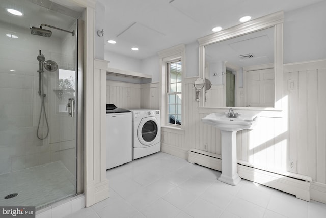 full bath with visible vents, recessed lighting, a shower stall, a baseboard heating unit, and washing machine and dryer