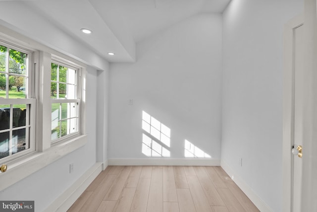 spare room featuring recessed lighting, baseboards, and light wood-type flooring