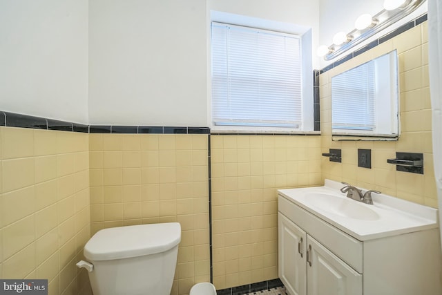 2426 S Chadwick St, Philadelphia, PA 19145 - half bath with vanity, toilet, and tile walls