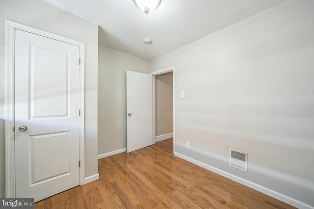 2426 S Chadwick St, Philadelphia, PA 19145 - unfurnished bedroom featuring visible vents, light wood-style flooring, and baseboards
