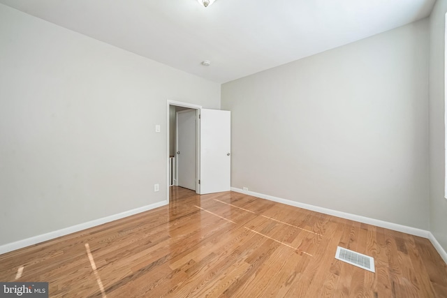 2426 S Chadwick St, Philadelphia, PA 19145 - empty room featuring visible vents, light wood-style flooring, and baseboards