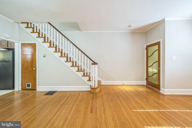 2426 S Chadwick St, Philadelphia, PA 19145 - interior space with crown molding, baseboards, stairs, and wood finished floors