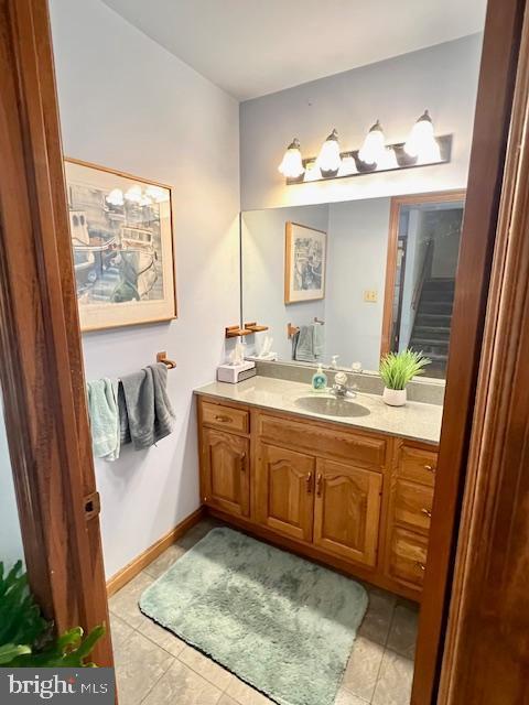 bathroom with tile patterned floors and vanity