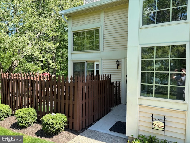 view of home's exterior with fence