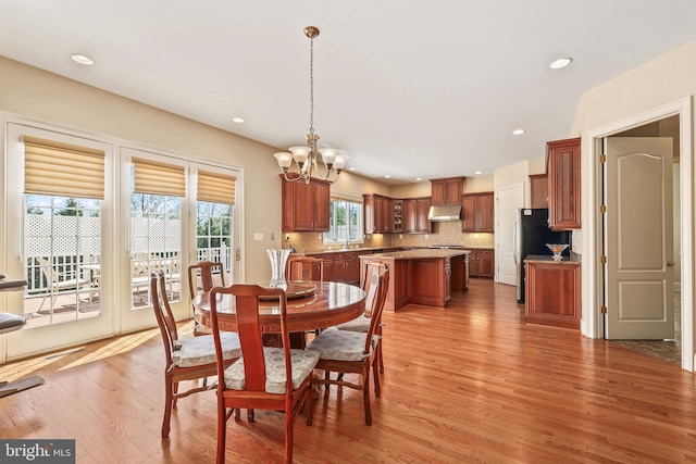 43112 Unison Knoll Cir, Ashburn, VA 20148 - dining room featuring recessed lighting, light wood finished floors, and a notable chandelier