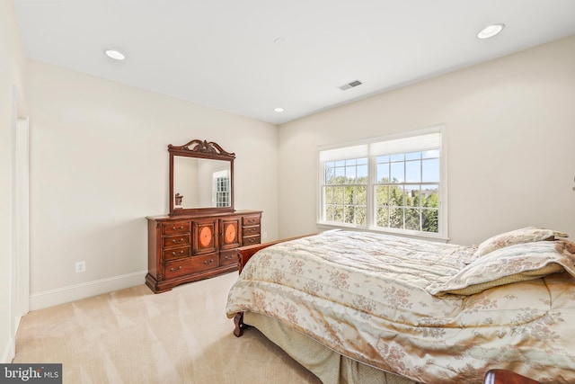 carpeted bedroom featuring recessed lighting, baseboards, and visible vents