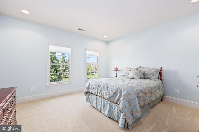 bedroom featuring baseboards, recessed lighting, and visible vents