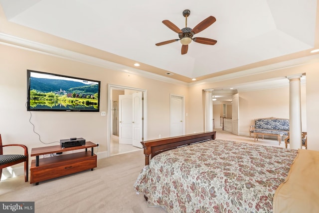 bedroom with crown molding, carpet, recessed lighting, ornate columns, and a tray ceiling