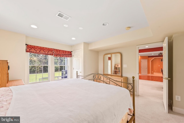 bedroom featuring recessed lighting, baseboards, visible vents, and light carpet