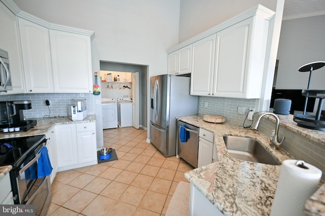 4501 Talcott Ter Unit Q, Perry Hall, MD 21128 - kitchen featuring a sink, independent washer and dryer, tasteful backsplash, and stainless steel appliances