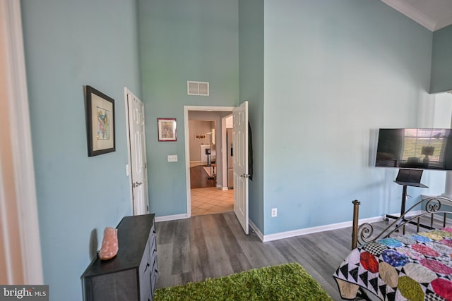4501 Talcott Ter Unit Q, Perry Hall, MD 21128 - bedroom featuring crown molding, a high ceiling, dark wood finished floors, baseboards, and visible vents