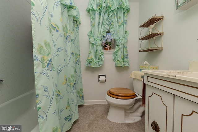 bathroom featuring toilet, baseboards, a shower with shower curtain, and vanity