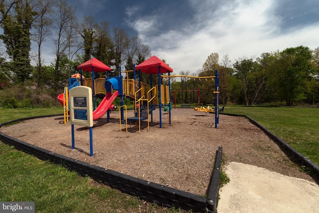 community jungle gym featuring a yard