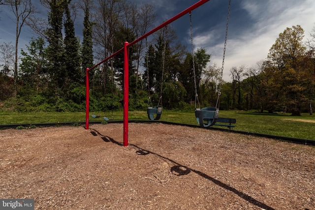communal playground featuring a yard