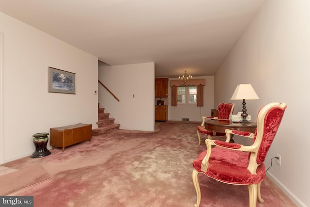 sitting room featuring stairs, carpet flooring, a chandelier, and visible vents