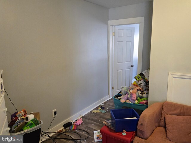 512 N Schroeder St, Baltimore, MD 21223 - rec room with wood finished floors and baseboards