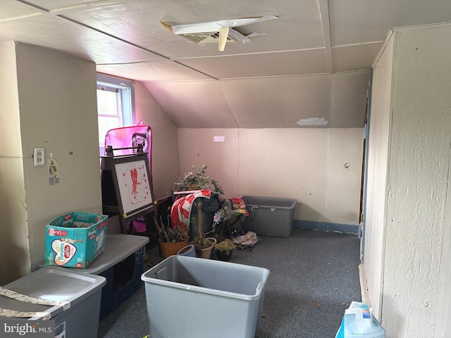 additional living space featuring vaulted ceiling